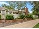 Backyard view with raised garden, fence and pergola, and a brick chimney at 13781 E Marina Dr # A, Aurora, CO 80014
