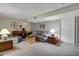 Finished basement with comfortable seating, decor, and ample lighting at 13781 E Marina Dr # A, Aurora, CO 80014