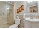 Modern bathroom with a glass-enclosed shower, vanity with ample storage, and neutral tones at 13781 E Marina Dr # A, Aurora, CO 80014