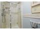 Well-maintained bathroom with tiled shower and niche, along with decorative framed artwork at 13781 E Marina Dr # A, Aurora, CO 80014