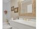 Bright bathroom featuring decorative mirror, tile details, and modern fixtures at 13781 E Marina Dr # A, Aurora, CO 80014