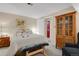 Bright bedroom with comfortable bedding, ample storage, and doorway to an additional room at 13781 E Marina Dr # A, Aurora, CO 80014