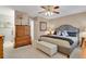 Comfortable bedroom with a ceiling fan, neutral walls, and carpeted flooring throughout at 13781 E Marina Dr # A, Aurora, CO 80014