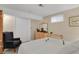 Serene bedroom with white bedding, window, closet, and natural light at 13781 E Marina Dr # A, Aurora, CO 80014