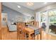 Dining room and living room with hardwood floors and a sliding door to the outdoors at 13781 E Marina Dr # A, Aurora, CO 80014