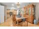 Dining room with hardwood floors features a large hutch and view of the kitchen at 13781 E Marina Dr # A, Aurora, CO 80014