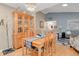 Open dining room featuring hardwood floors and view into the open concept living area at 13781 E Marina Dr # A, Aurora, CO 80014