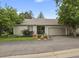 Attractive home with an attached garage, tidy landscaping, and a welcoming entryway at 13781 E Marina Dr # A, Aurora, CO 80014