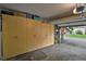 Spacious garage with ample storage cabinets and an open garage door view to the neighborhood at 13781 E Marina Dr # A, Aurora, CO 80014