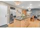 Eat-in kitchen with stainless appliances, granite countertops, and view into the dining room at 13781 E Marina Dr # A, Aurora, CO 80014