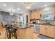Bright kitchen boasts a granite island with barstool seating and stainless steel appliances at 13781 E Marina Dr # A, Aurora, CO 80014