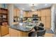 Spacious eat-in kitchen with granite countertops, ample cabinetry, and a kitchen island with seating at 13781 E Marina Dr # A, Aurora, CO 80014