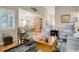 Bright living room with hardwood floors, comfortable seating, and seamless flow to dining at 13781 E Marina Dr # A, Aurora, CO 80014