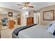 Spacious main bedroom with a ceiling fan, large closets, neutral color scheme, and bedside dressers at 13781 E Marina Dr # A, Aurora, CO 80014