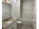 Bathroom with tub, single vanity, and granite countertop at 15700 E Jamison Dr # 5-307, Englewood, CO 80112