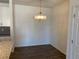 Dining area with hardwood floors and a chandelier at 15700 E Jamison Dr # 5-307, Englewood, CO 80112