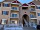 Exterior of a modern apartment building with stairs and accessible entrance at 15700 E Jamison Dr # 5-307, Englewood, CO 80112