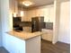 Modern kitchen with stainless steel appliances and granite countertops at 15700 E Jamison Dr # 5-307, Englewood, CO 80112