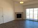 Living room with hardwood floors, fireplace, and sliding glass doors at 15700 E Jamison Dr # 5-307, Englewood, CO 80112