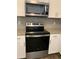 Stainless steel Whirlpool range and microwave at 15700 E Jamison Dr # 5-307, Englewood, CO 80112