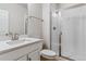 Clean bathroom with a glass shower and white vanity at 25061 E 38Th Ave, Aurora, CO 80019