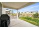 Covered patio overlooking a well-maintained yard with a wooden fence at 1101 E Witherspoon Dr, Elizabeth, CO 80107