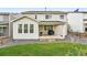 The backyard features a covered patio and manicured lawn, perfect for outdoor activities and relaxation at 1101 E Witherspoon Dr, Elizabeth, CO 80107