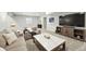 Basement featuring neutral decor, plush carpeting, a large TV, and comfortable seating at 1101 E Witherspoon Dr, Elizabeth, CO 80107