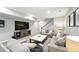 Finished basement with plush carpeting, neutral walls, a large TV, and comfortable seating at 1101 E Witherspoon Dr, Elizabeth, CO 80107