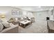 Basement featuring neutral decor, plush carpeting, a large TV, and comfortable seating at 1101 E Witherspoon Dr, Elizabeth, CO 80107