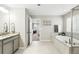 Luxurious bathroom featuring a soaking tub, walk-in shower, and stylish vanity, creating a spa-like retreat at 1101 E Witherspoon Dr, Elizabeth, CO 80107