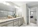 Elegant bathroom with a double vanity, soaking tub, and separate shower, offering comfort and style at 1101 E Witherspoon Dr, Elizabeth, CO 80107