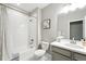 Bright bathroom with a shower-tub combo and gray vanity at 1101 E Witherspoon Dr, Elizabeth, CO 80107