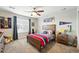 Cozy bedroom featuring a wood bed frame, ceiling fan, and window with ample natural light at 1101 E Witherspoon Dr, Elizabeth, CO 80107