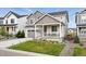 Charming two-story home with a well-manicured lawn and a covered front porch at 1101 E Witherspoon Dr, Elizabeth, CO 80107