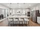 Bright kitchen with stainless steel appliances, a large island, and ample counter space at 1101 E Witherspoon Dr, Elizabeth, CO 80107