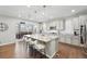 Bright, open kitchen features a large center island with seating and opens to dining area at 1101 E Witherspoon Dr, Elizabeth, CO 80107
