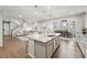 Open floor plan with bright kitchen featuring granite counters overlooking dining and living areas at 1101 E Witherspoon Dr, Elizabeth, CO 80107
