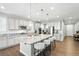 A spacious kitchen boasts a large island with granite countertops and modern stainless steel appliances at 1101 E Witherspoon Dr, Elizabeth, CO 80107
