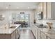 A bright kitchen with granite countertops and stainless appliances opens to the dining area at 1101 E Witherspoon Dr, Elizabeth, CO 80107