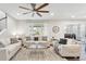 Bright living room with neutral decor, comfortable seating, and a ceiling fan for added comfort at 1101 E Witherspoon Dr, Elizabeth, CO 80107