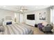 Relaxing main bedroom with a TV, sitting area, and ensuite bathroom, offering comfort and convenience at 1101 E Witherspoon Dr, Elizabeth, CO 80107
