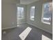 Sunlit bedroom with carpet and three windows at 1652 N Lafayette St # 1, Denver, CO 80218