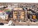 Aerial view of the modern apartment building with balconies in a vibrant urban setting at 1925 W 32Nd Ave # 502, Denver, CO 80211