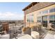 Spacious balcony with cozy seating, outdoor grill, and planters, offering a perfect spot to relax and enjoy the view at 1925 W 32Nd Ave # 502, Denver, CO 80211