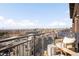 Balcony view overlooking city and the Rocky Mountains, featuring patio seating and a relaxing outdoor space at 1925 W 32Nd Ave # 502, Denver, CO 80211