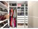 Organized closet with shelves, drawers, and hanging space for clothes, shoes, and accessories at 1925 W 32Nd Ave # 502, Denver, CO 80211