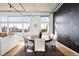 Stylish dining area features city views, a round table with seating, and a floral accent wall at 1925 W 32Nd Ave # 502, Denver, CO 80211