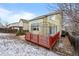 Exterior view of home with a deck, pergola, and a low-maintenance yard at 10463 Adams St, Northglenn, CO 80233