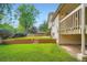 The backyard boasts a lush lawn and tiered garden beds at 4780 W 102Nd Pl, Westminster, CO 80031
